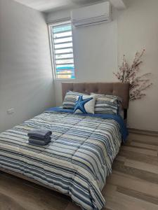 Postel nebo postele na pokoji v ubytování Parguera Beach Club & Hotel