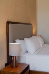 Postel nebo postele na pokoji v ubytování Kahal Hotel - Paseo Montejo