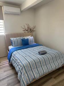 Postel nebo postele na pokoji v ubytování Parguera Beach Club & Hotel