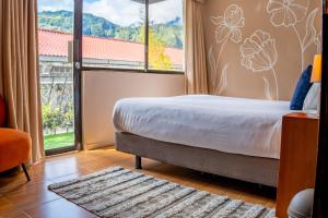 Hotel Agave Baños客房内的一张或多张床位