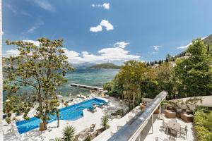 a view of the water and a swimming pool at All'oro in Njivice