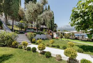 a view of a garden with stairs and trees at All'oro in Njivice