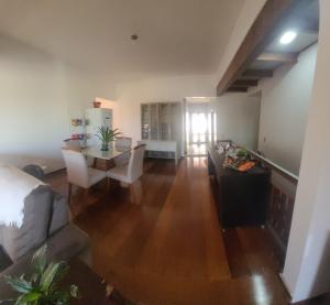 an empty living room with a couch and a table at LM Hotel Araçatuba in Araçatuba +5 photos