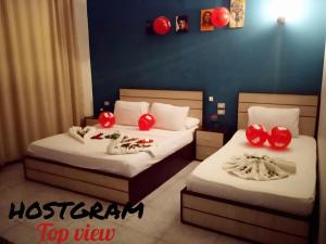 A bed or beds in a room at Hostgram Top View