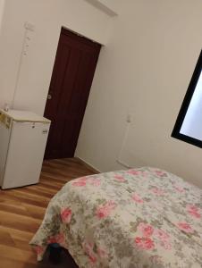 Postel nebo postele na pokoji v ubytování Auyama Bar