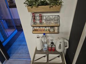 a room with a shelf with toiletries on a wall at Glamour Wellness Apartments in Zagreb