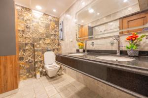 a bathroom with a sink and a toilet in a room at Royal Heliopolis in Cairo +30 photos