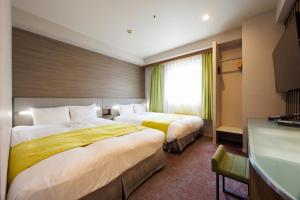 Postel nebo postele na pokoji v ubytování Hotel Sardonyx Ueno