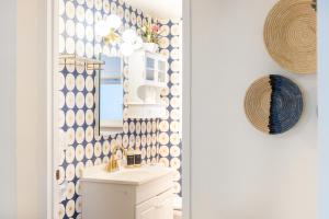 a bathroom with a sink and a mirror at Quiet City Retreat Near Light Rail, Downtown & Stadiums! in Seattle +74 photos