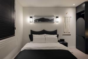 Aank Hotel and Spa Daejeon Yuseong客房内的一张或多张床位