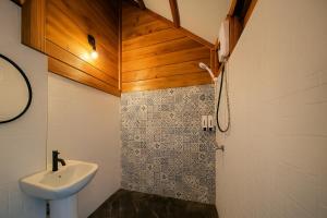 a small bathroom with a sink and a toilet at Nalintara resort นลินธารารีสอร์ท in Ban Pha Saeng Lang +46 photos