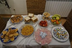 a table with many plates of food on it at Hotel Elizondo in Elizondo