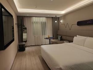 Voodi või voodid majutusasutuse Atour Light Hotel Beijing Guang'anmen toas
