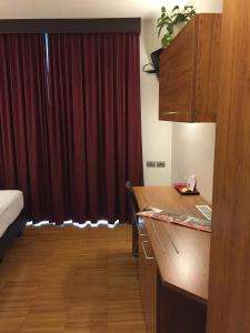 Postel nebo postele na pokoji v ubytování Al Marinaio Hotel Garni