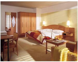 a bedroom with a bed and a desk and a table at Landgasthof & Landhotel Wild in Haunwang
