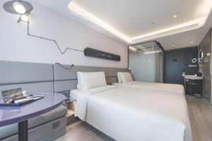 Voodi või voodid majutusasutuse Atour Light Hotel Beijing Guang'anmen toas