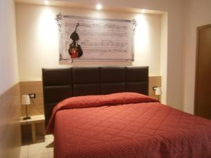 Letto o letti in una camera di Albergo Visconti
