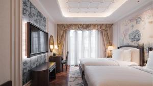 Postel nebo postele na pokoji v ubytování Golden Imperial Hotel + 37 fotografií
