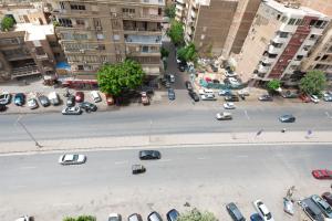 an aerial view of a city street with cars parked at Royal Heliopolis in Cairo