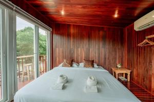 Postel nebo postele na pokoji v ubytování 19 Degrees Resort + 211 fotografií