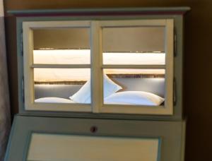 A bed or beds in a room at Weingut Georgium