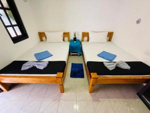 You Can Beach Resort Uppuveli 객실 침대
