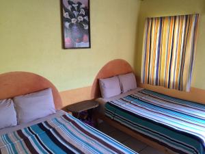 Postel nebo postele na pokoji v ubytování Hotel Las Salinas