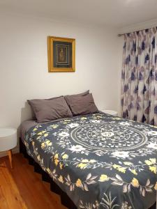 Letto o letti in una camera di Otumoetai Shared Family Home - Sherwood Food Forest, New Zealand