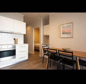 a kitchen and dining room with a table and chairs at The Cove in Vosburg