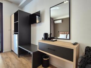 Kuchyň nebo kuchyňský kout v ubytování Augusto Rooms