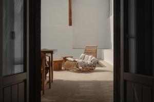 A bed or beds in a room at Siora of Paros - Ammiralis & Castelis