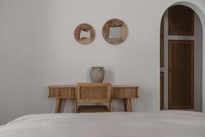 A bed or beds in a room at Siora of Paros - Ammiralis & Castelis