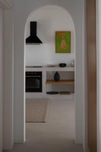 A kitchen or kitchenette at Siora of Paros - Ammiralis & Castelis