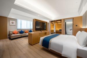 Postel nebo postele na pokoji v ubytování Guangzhou Baiyun Airport COCO Hotel + 37 fotografií