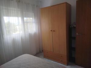 Posteľ alebo postele v izbe v ubytovaní Apartamento estudio en playa Puig
