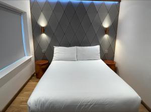 Postel nebo postele na pokoji v ubytování RIOSHOUSE Henley