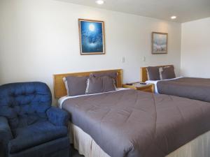 מיטה או מיטות בחדר ב-Jailhouse Motel and Casino
