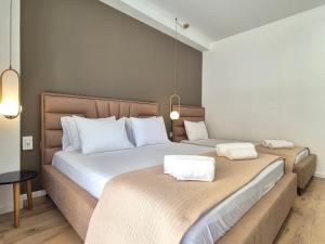 Postel nebo postele na pokoji v ubytování Augusto Rooms