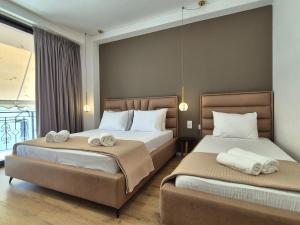 Postel nebo postele na pokoji v ubytování Augusto Rooms