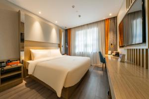 TV a/nebo společenská místnost v ubytování Atour X Hotel Beijing Sanyuan Bridge