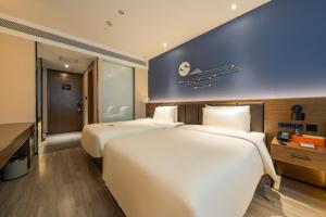 Postel nebo postele na pokoji v ubytování Atour X Hotel Beijing Sanyuan Bridge