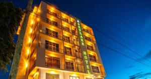 a tall building with lights on the side of it at Skylark Hotel in Karatu