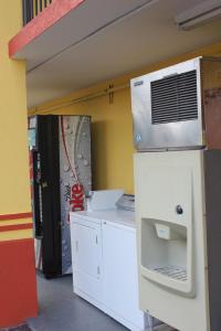 a room with a white appliance in a room at Days Inn by Wyndham Athens in Athens