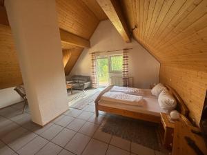a bedroom with a large bed in an attic at Zum Kaiserwirt in Heppenheim an der Bergstrasse