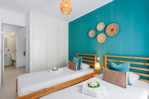 Łóżko lub łóżka w pokoju w obiekcie MEDANO4YOU Casa Toya
