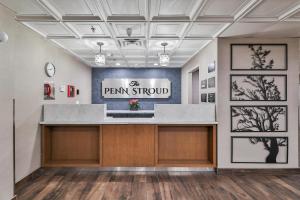 a lobby of a firm should with a sign on the wall at The Penn Stroud, Stroudsburg - Poconos, Ascend Hotel Collection in Stroudsburg