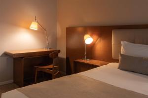 Ein Bett oder Betten in einem Zimmer der Unterkunft Dazzler by Wyndham Montevideo