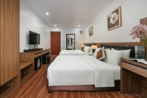 En eller flere senge i et værelse på Lam Anh Hotel 2 Dương Nội Hà Đông