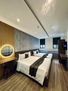 Postel nebo postele na pokoji v ubytování ON Hotel
