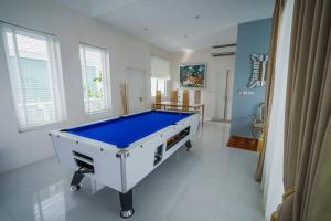 a large room with a pool table in it at มาวิน 11 in Hua Hin +8 photos